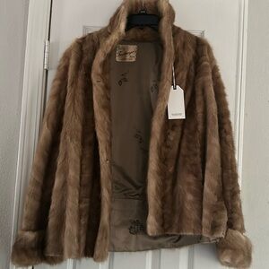 Faux fur coat with tags. My mom bought it but never wore it.